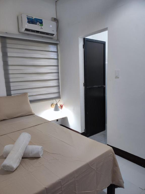 Postel nebo postele na pokoji v ubytování Aloha Hostel Siargao