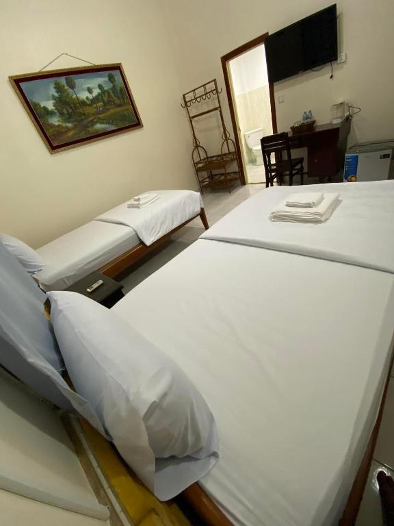 Postel nebo postele na pokoji v ubytování Ecran Riverfront Guesthouse