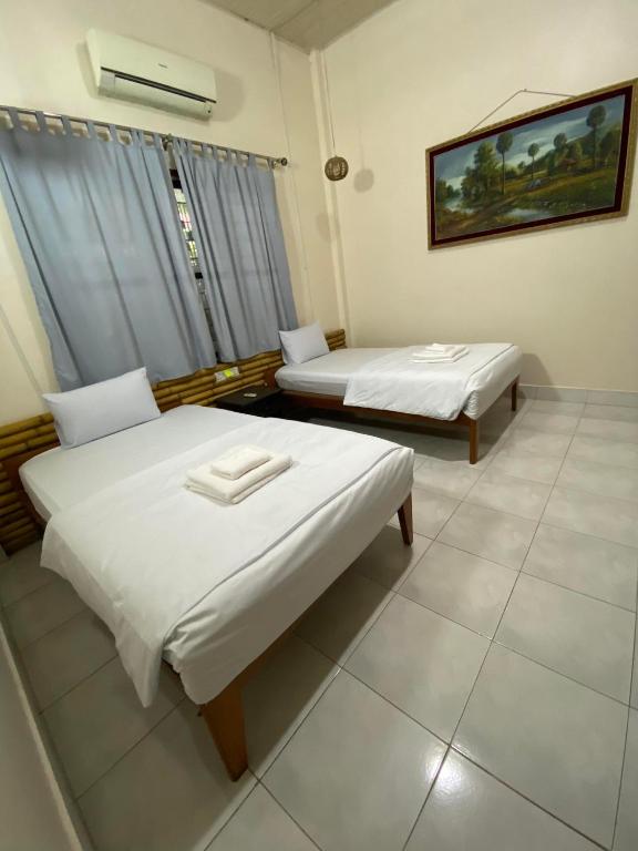Postel nebo postele na pokoji v ubytování Ecran Riverfront Guesthouse