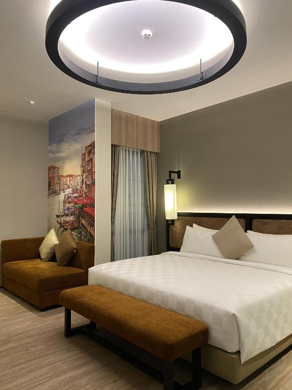 Postel nebo postele na pokoji v ubytování Posto Dormire Sudirman