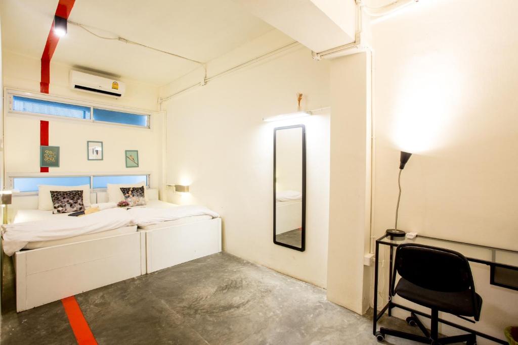 Postel nebo postele na pokoji v ubytování Qilombo Hostel Silom - HQ