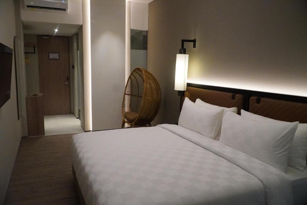 Postel nebo postele na pokoji v ubytování Posto Dormire Sudirman
