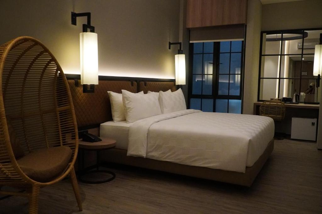 Postel nebo postele na pokoji v ubytování Posto Dormire Sudirman