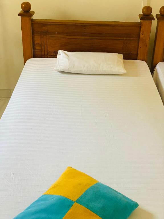 Postel nebo postele na pokoji v ubytování Sunflower Inn
