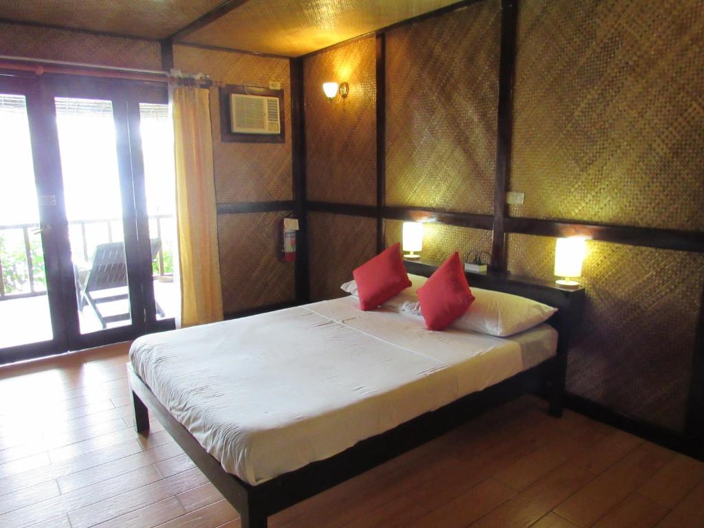 Postel nebo postele na pokoji v ubytování DACOZY Beach Resort