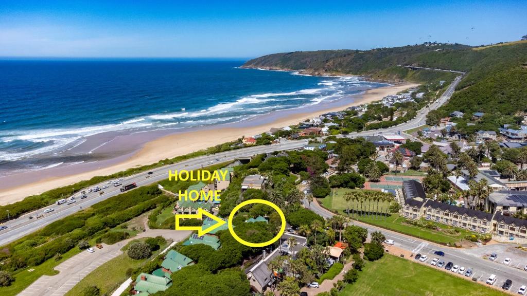an aerial view of a beach with a yellow sign at Heart of Wilderness - 250m from beach - Sleeps 6 in Wilderness