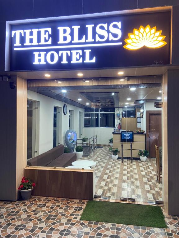 a building with a sign that reads the bliss hotel at The Bliss Dhanaulti in Dhanaulti
