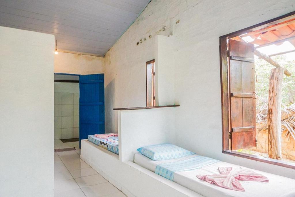 Uma cama ou camas num quarto em Pousada Mirage Atins