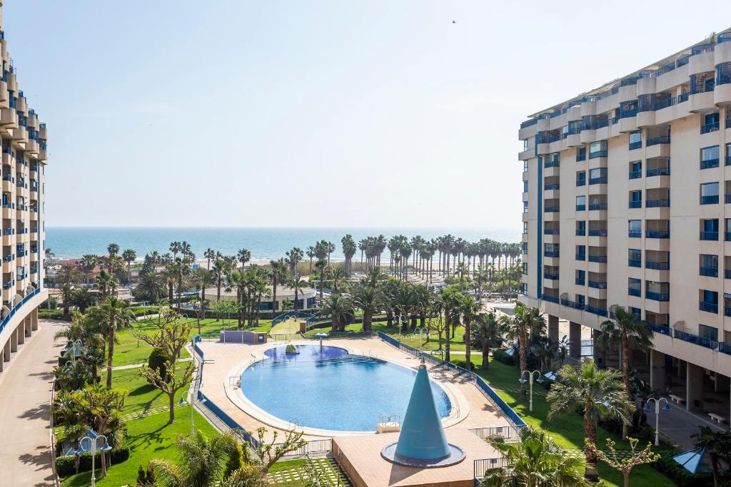 an aerial view of a swimming pool in a resort at RESORT BEACH VALENCIA in Valencia