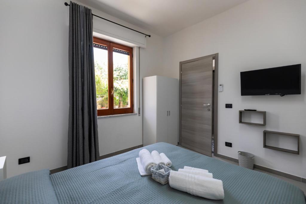 Postel nebo postele na pokoji v ubytování Residenza De Vita