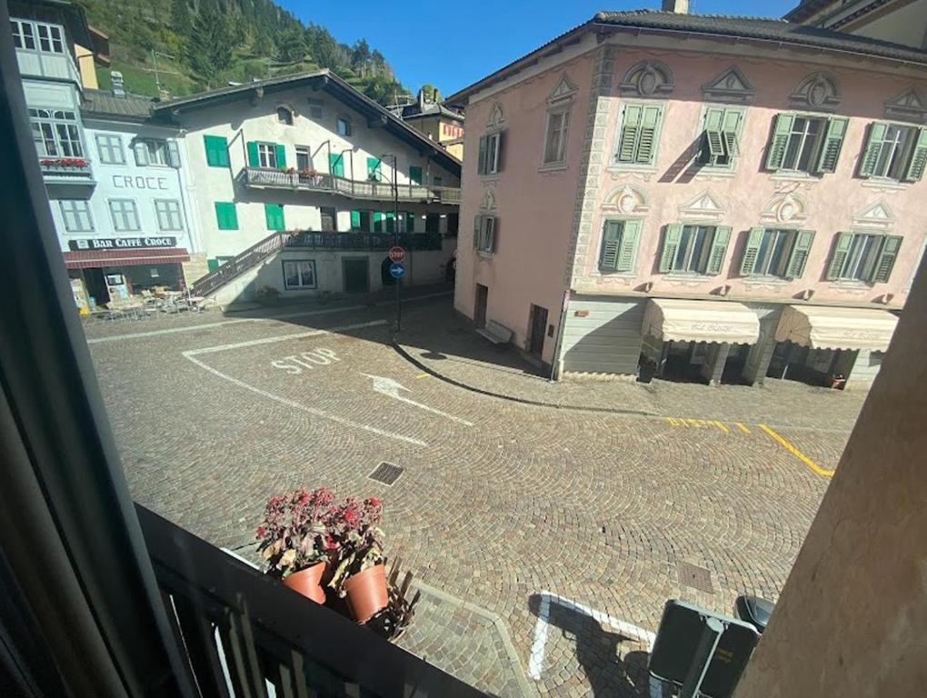 a view from a balcony of a street with buildings at San15 in Predazzo