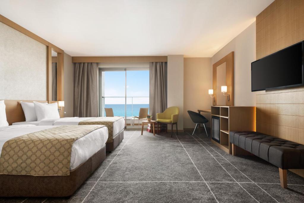 A television and/or entertainment centre at Ramada Resort by Wyndham Unye