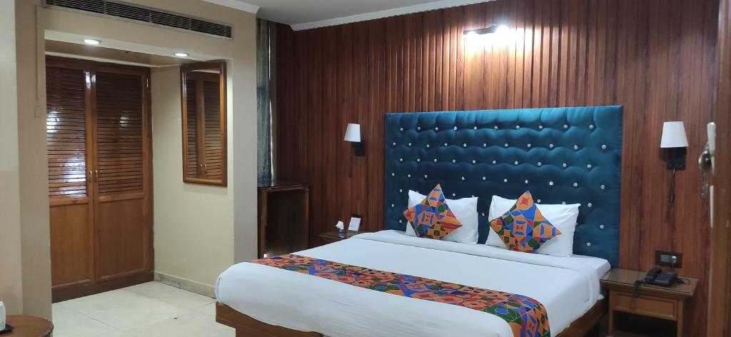 Postel nebo postele na pokoji v ubytování HOTEL CONCLAVE EXECUTIVE