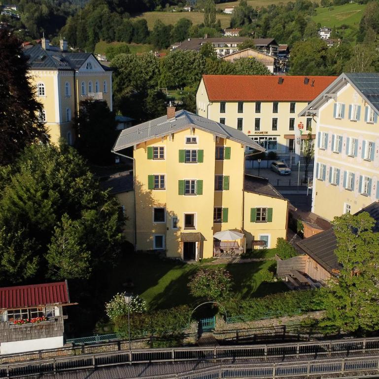 a group of buildings in a city next to a train at Ferienhaus Steinbacher direkt am Tegernsee in Tegernsee
