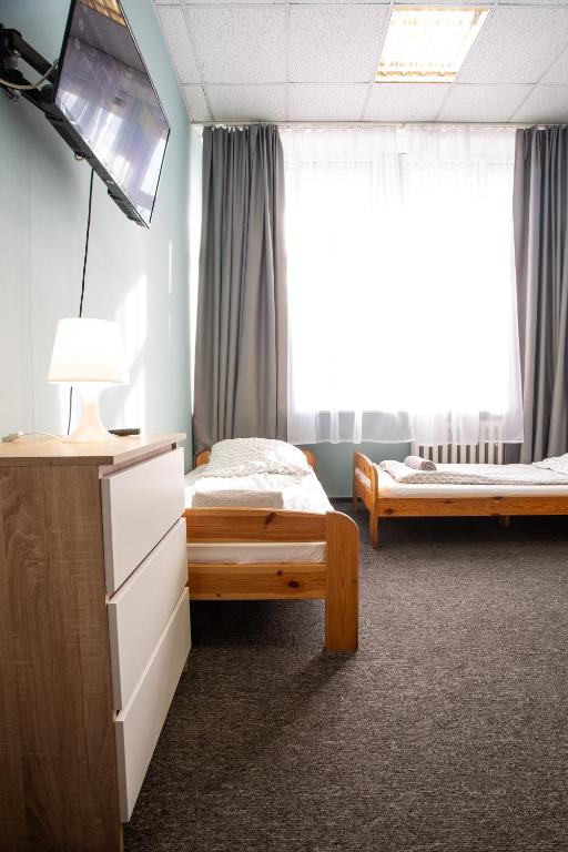 Postel nebo postele na pokoji v ubytování Moon Hostel Wrocław
