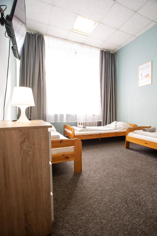 Postel nebo postele na pokoji v ubytování Moon Hostel Wrocław