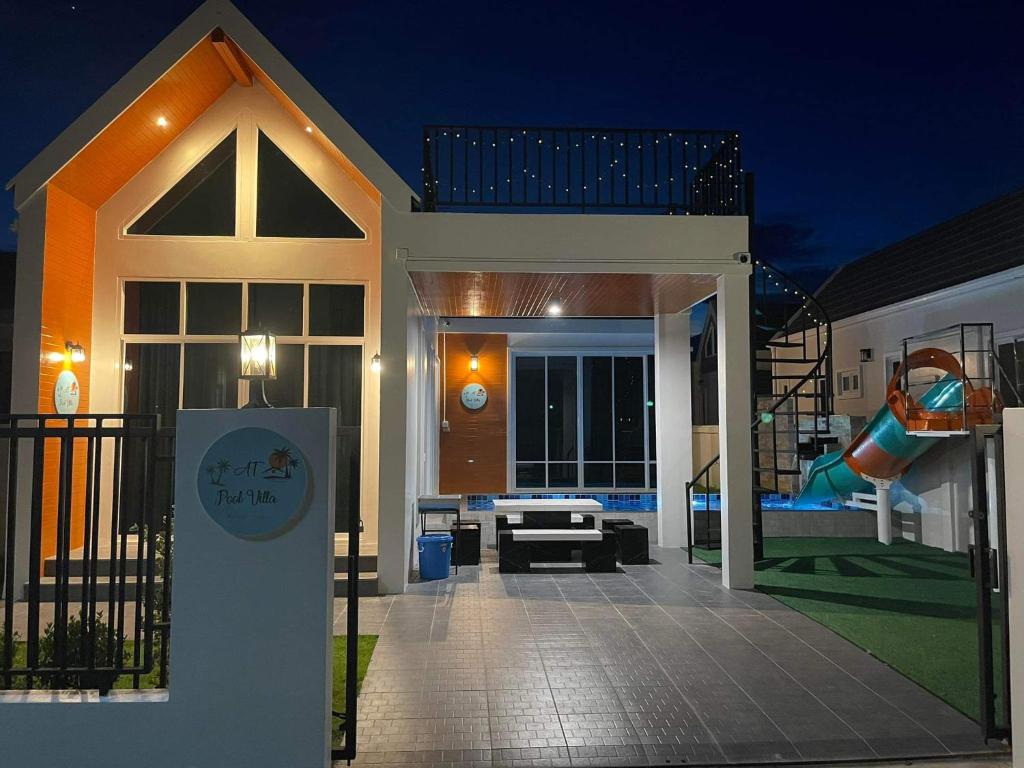 a house with a playground with a slide at ATPoolVillaHuaHin เอทีพูลวิลล่าหัวหิน in Ban Wang Bot