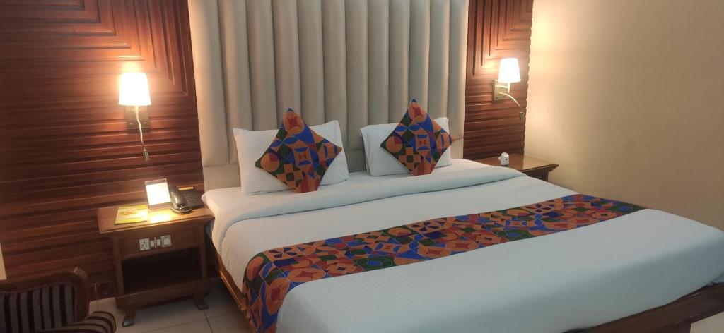 Postel nebo postele na pokoji v ubytování HOTEL CONCLAVE EXECUTIVE