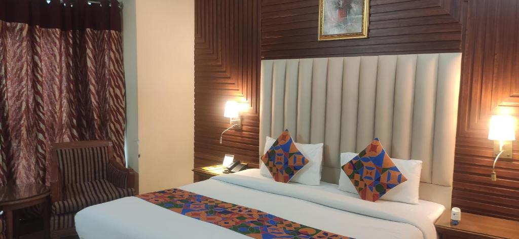 Postel nebo postele na pokoji v ubytování HOTEL CONCLAVE EXECUTIVE