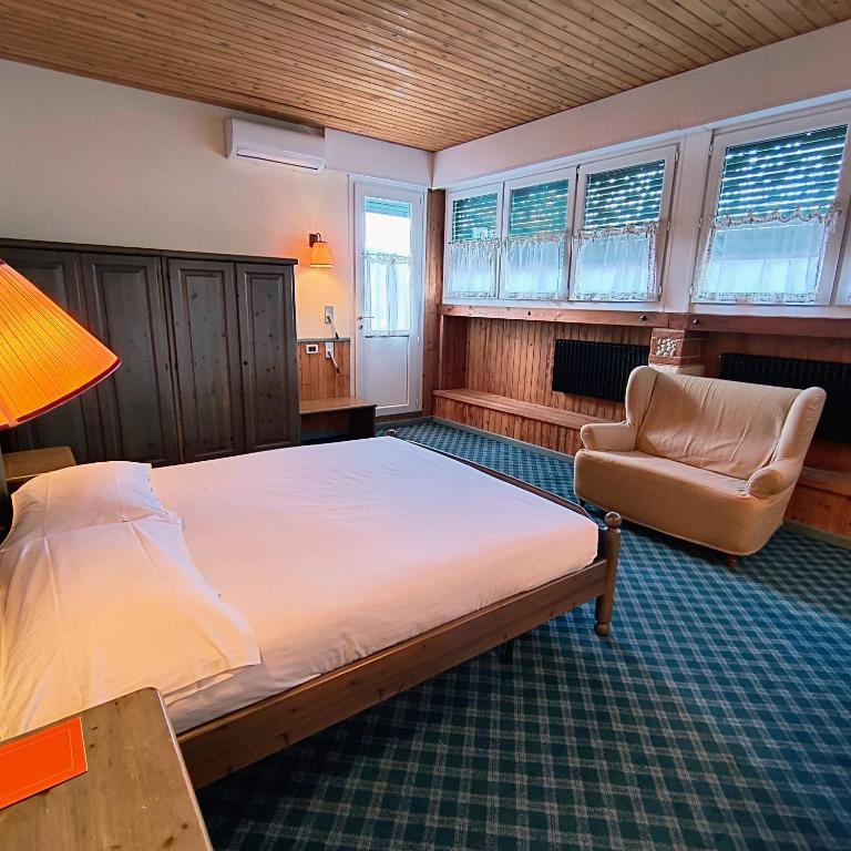 Postel nebo postele na pokoji v ubytování Hotel Miramonti