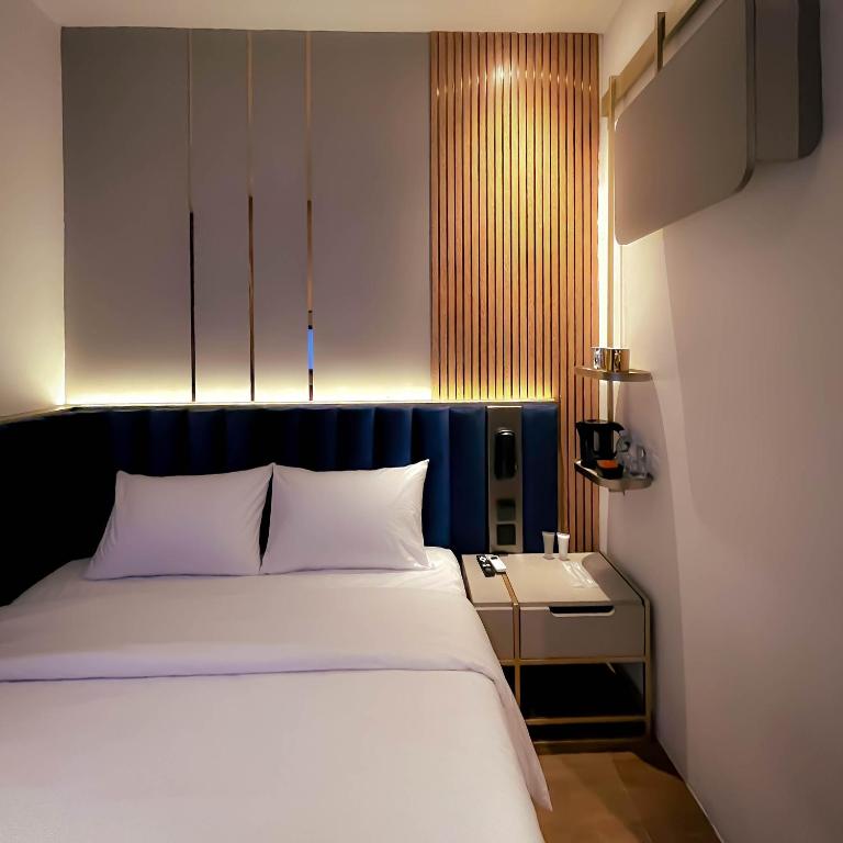 Postel nebo postele na pokoji v ubytování Qube Hotel by 98hospitality