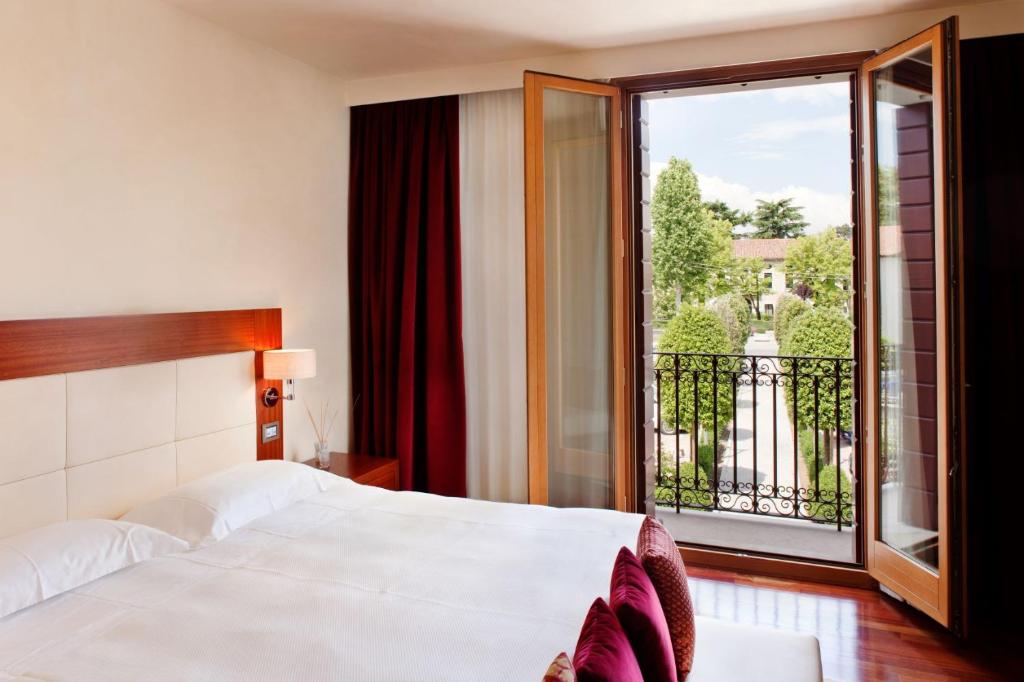 Posteľ alebo postele v izbe v ubytovaní Al Tezzon Hotel