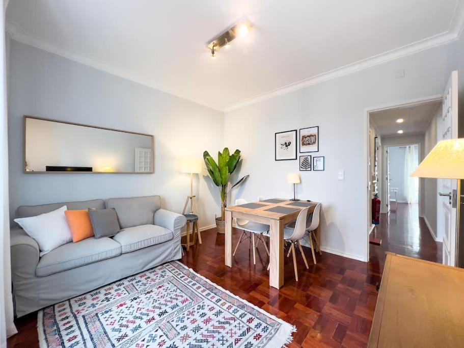 a living room with a couch and a table at Olaias Lisbon 2bed near Metro in Lisbon