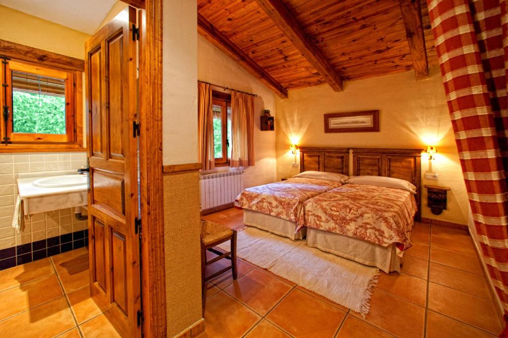 Postel nebo postele na pokoji v ubytování Cortijo De Ramón