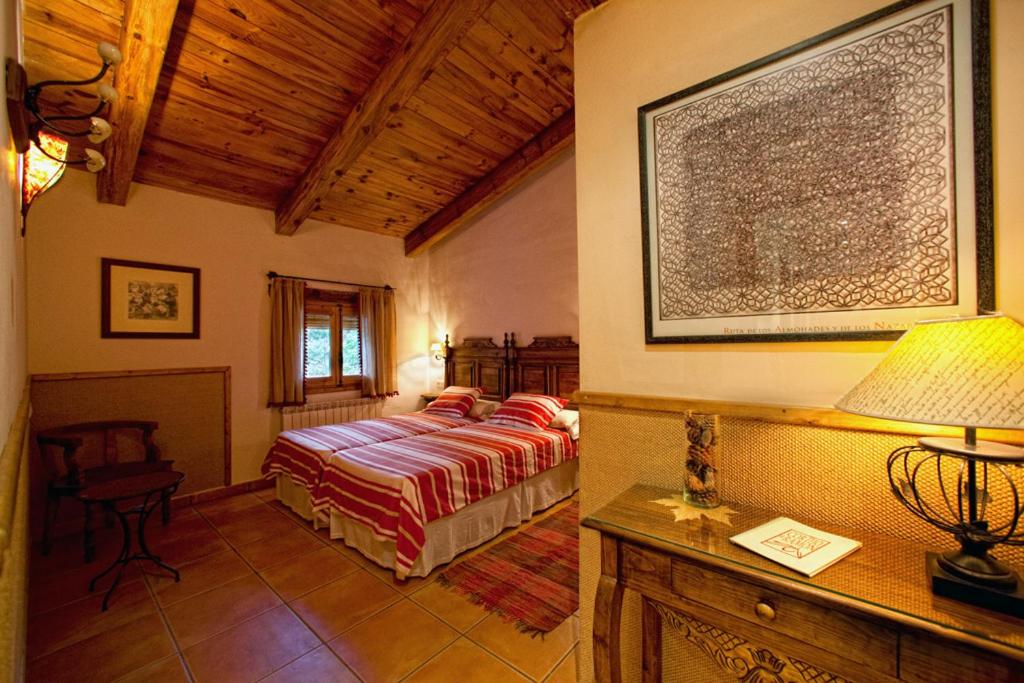 Postel nebo postele na pokoji v ubytování Cortijo De Ramón