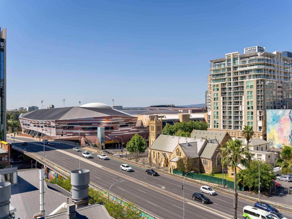 a city with a highway and a building and cars at Adelaide Rockford in Adelaide