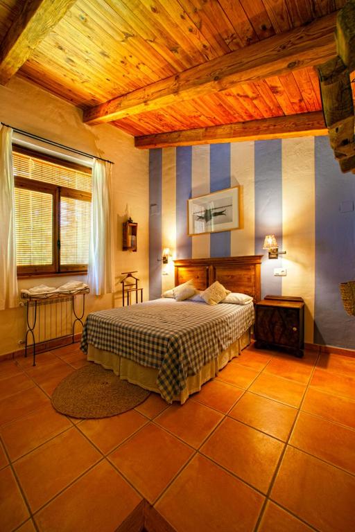 Postel nebo postele na pokoji v ubytování Cortijo De Ramón