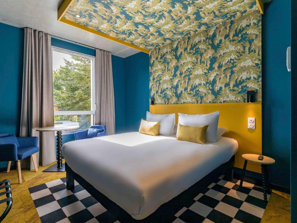 Postel nebo postele na pokoji v ubytování ibis Styles Dijon Sud Domaine De Beauregard 21600 Longvic