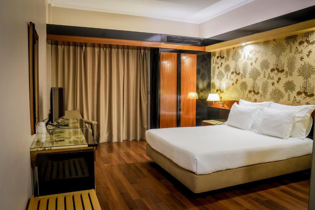 Postel nebo postele na pokoji v ubytování Hotel Lara