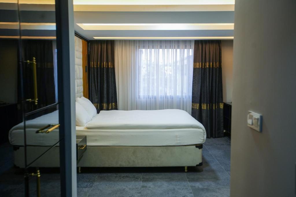 Postel nebo postele na pokoji v ubytování KY Continental Apartments
