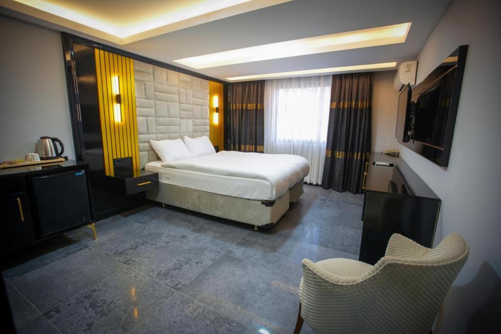 Postel nebo postele na pokoji v ubytování KY Continental Apartments