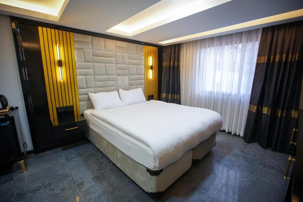 Postel nebo postele na pokoji v ubytování KY Continental Apartments