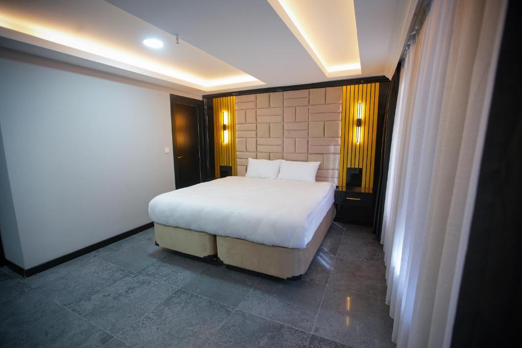 Postel nebo postele na pokoji v ubytování KY Continental Apartments