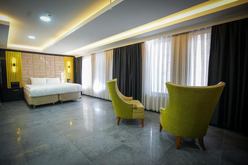Postel nebo postele na pokoji v ubytování KY Continental Apartments