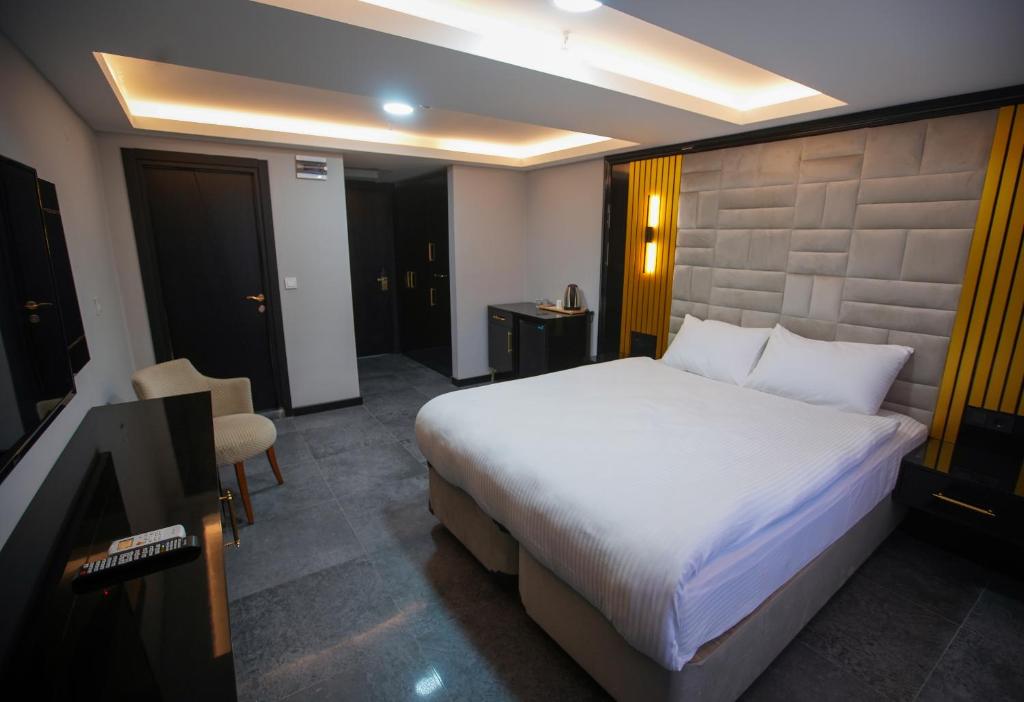 Postel nebo postele na pokoji v ubytování KY Continental Apartments