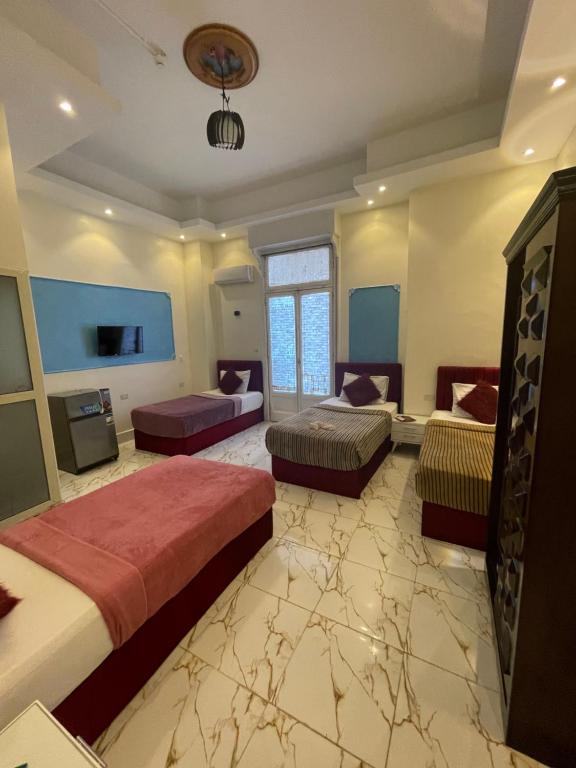 Postel nebo postele na pokoji v ubytování New One Hotel
