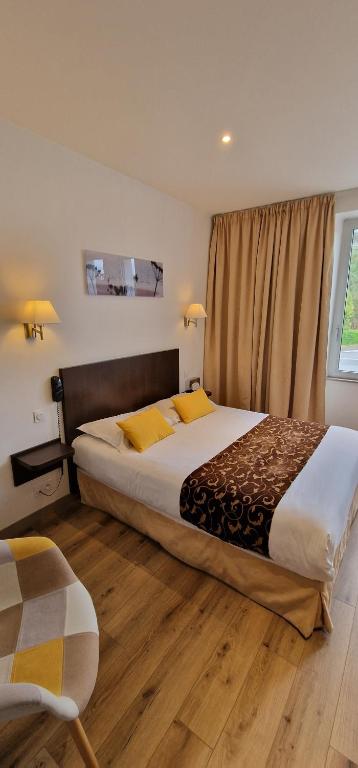 Postel nebo postele na pokoji v ubytování Hotel le Bellevue