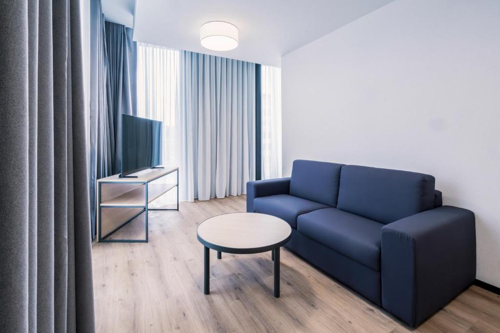 TV a/nebo společenská místnost v ubytování YParc Hôtel