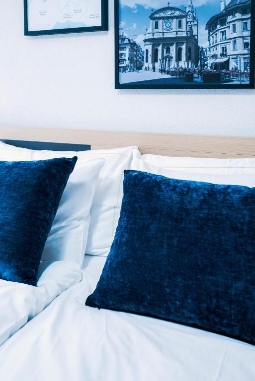 Postel nebo postele na pokoji v ubytování YParc Hôtel