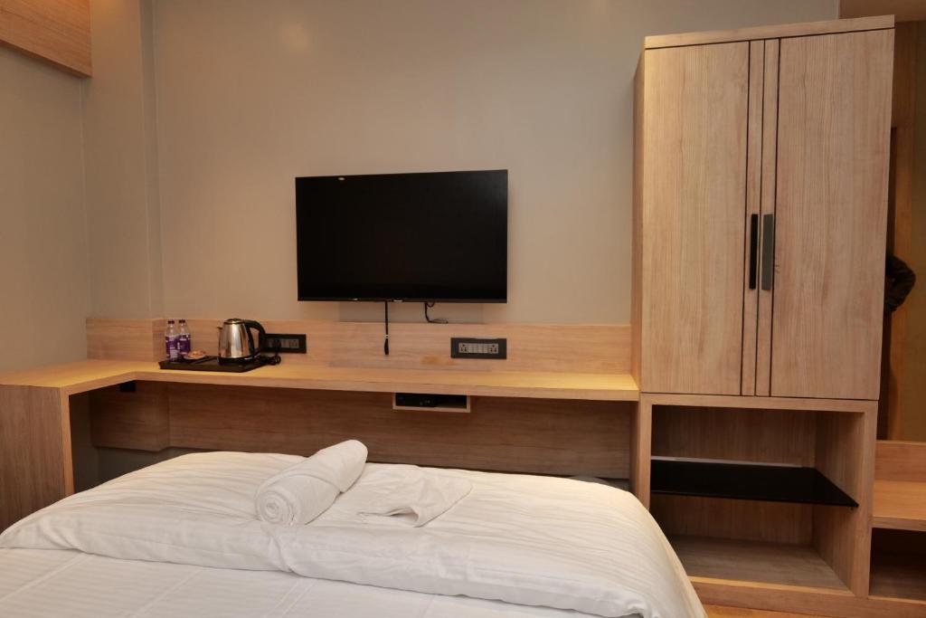 Postel nebo postele na pokoji v ubytování V HOTEL