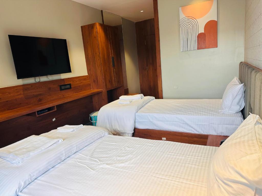 Postel nebo postele na pokoji v ubytování V HOTEL