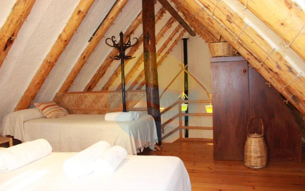 Postel nebo postele na pokoji v ubytování Barraca típica del Delta, con piscina, jardín y barbacoa - Deltavacaciones