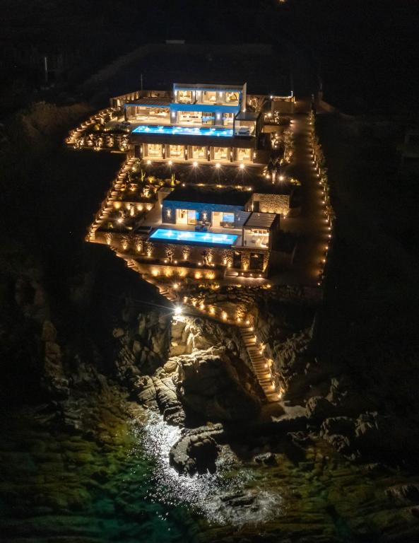 an aerial view of a building lit up at night at Splendid Mykonos Waterfront Villa in Mikonos