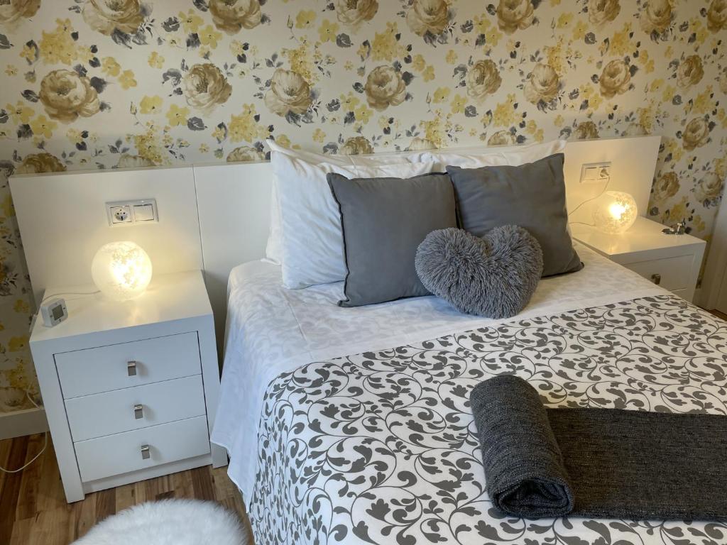 Postel nebo postele na pokoji v ubytování Silver Home