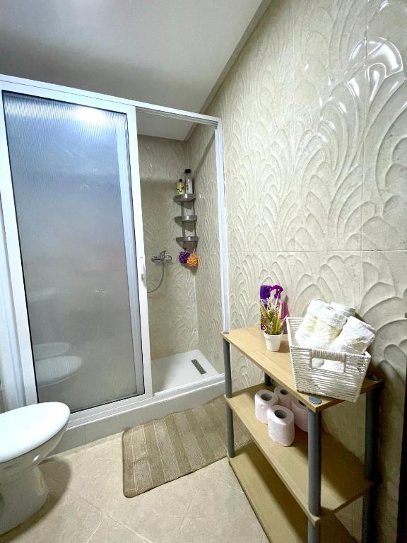 a bathroom with a shower and a toilet and a sink at Appartement Tanger Moulay Ismail in Tangier