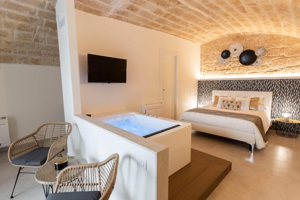 Postel nebo postele na pokoji v ubytování B&B Torre Canina suite & rooms